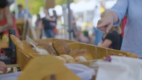Customer buying bread in the market Stock Footage 87808526