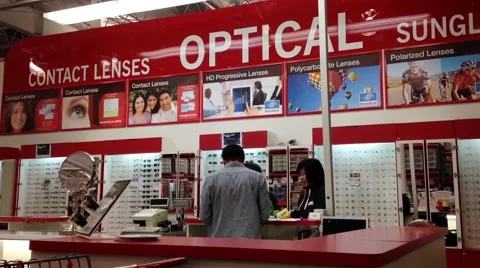 Customer buying glasses inside optical store Stock Footage 52300054