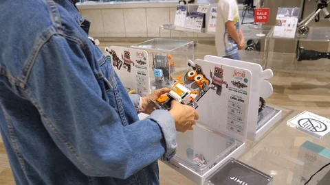 Customer Buying Robot Ubtech Jimu. Artificial Intelligence And Innovations. Stock Footage 100978640