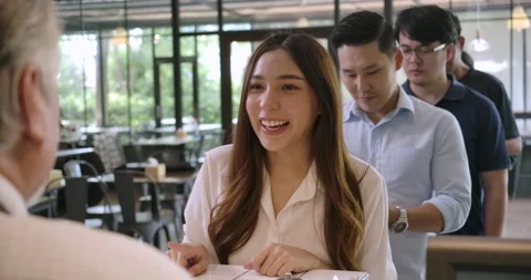 Customer in cafe makes payment with mobile phone. Video stock 153024255