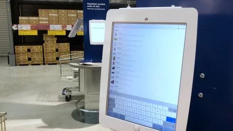 Customer check their item through device at IKEA store 스톡 동영상 112038711