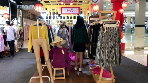 Customer choose clothes Stock Footage 171147723