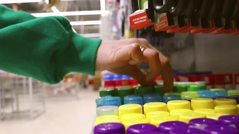Customer chooses glue in the store. Stock Footage 242360677
