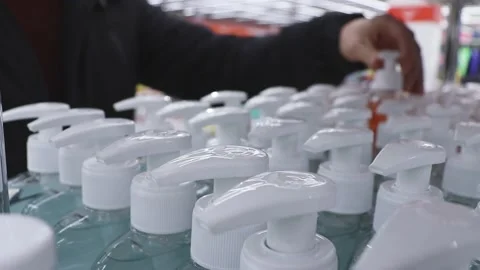 Customer chooses liquid soap in store or supermarket Stock Footage 221861437