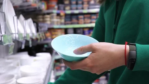 The customer chooses plates in the store Stock Footage 241835115