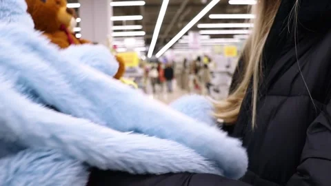 Customer chooses a soft toy in the store Video stock 243127497