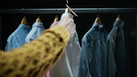 Customer choosing clothes to buy Stock Footage 254770178
