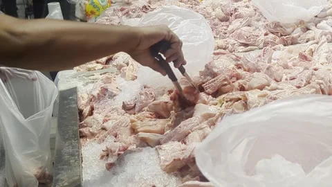 Customer Choosing Fresh Raw Chicken at Traditional Market Stall Stock Footage 328971600