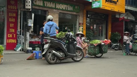 Customer-choosing-fresh-vegetables-at-local-street-market Stock Footage 340471879