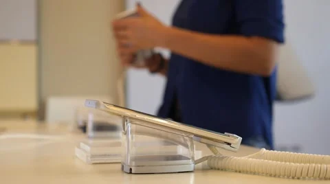Customer Choosing Mobile Phone in Shop. Focus on Smartphone Vídeo Stock 66549632