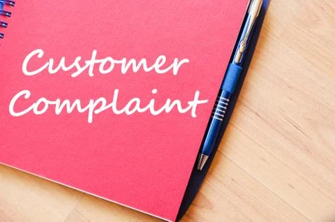 Customer complaint write on notebook Stock Photos