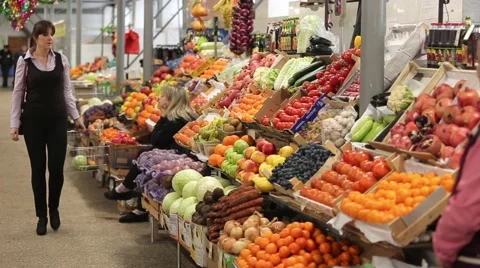 Customer at the counter to pick fruit and approaching seller Stock Footage 59337071