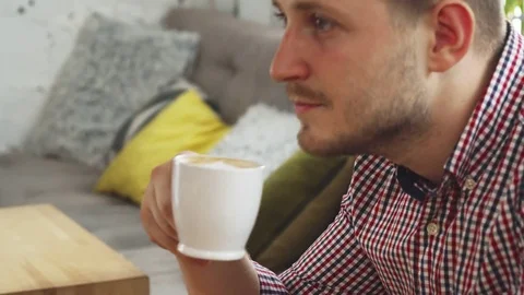 The customer is drinking coffee Stock Footage 80279447