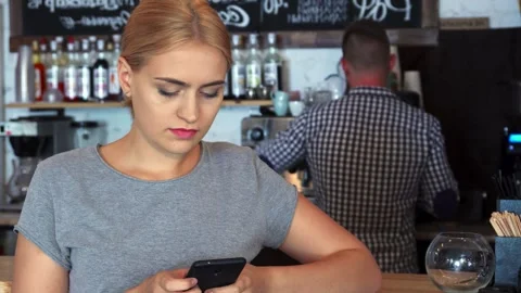 The customer is eagerly waiting for her coffee order Stock Footage 311939658