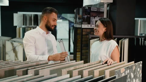 Customer Engages with Consultant Over Tile Selection Choices 스톡 동영상 291719781