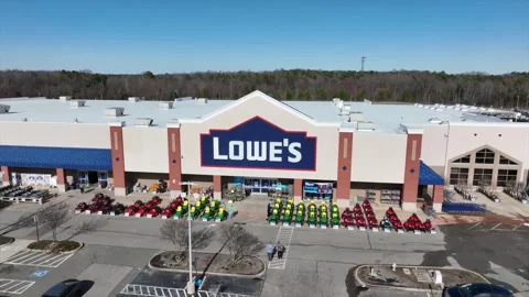 Customer entering LOWES Store during sunny day in Richmond, VA. Rising drone Stock Footage 304688273