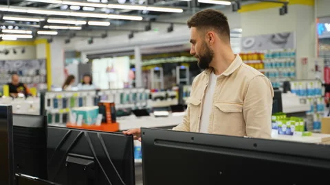 Customer examining television in electronics store on Black Friday Stock Footage 317725491