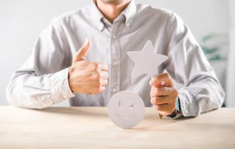 Customer feedback and satisfaction concept shows person giving thumbs up, h.. Stock Photos