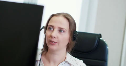 Customer Female support operator with headset and smiling Stock Footage 167963894