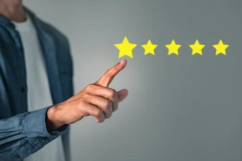 Customer five star review rate concept with hand pressing for a good rating.. Stock Photos