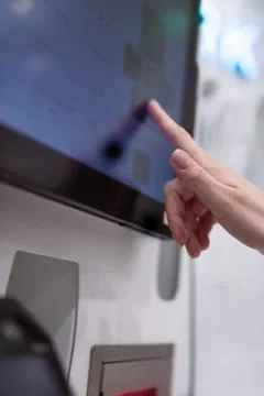 Customer hand interacting with a digital interface on a modern touchscreen .. Stock Photos
