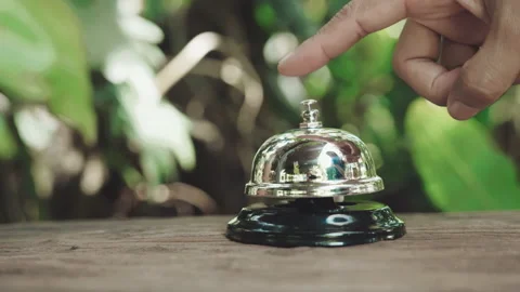 Customer hand ringing service bell at coffee cafe shop for calling the staff Stock Footage 201174400