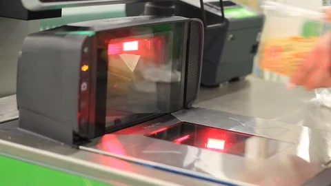 Customer hand scanning barcode of food under price scanner machine installed on Stock Footage 118660432