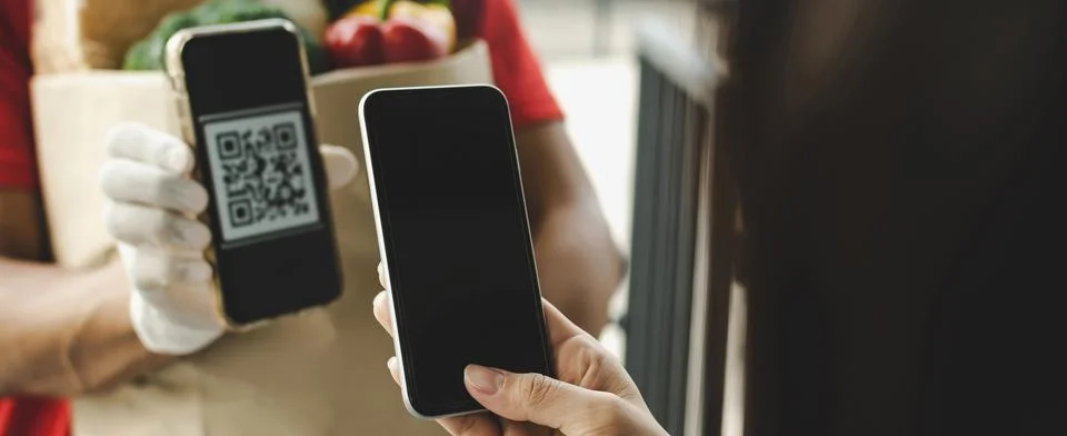 Customer hand using digital mobile phone scan QR code paying for buy fresh food Stock Photos