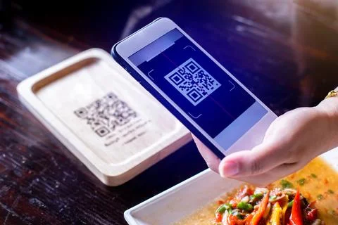 Customer hand using smart phone to scan QR code tag on wood to accepted gen.. Stock Photos