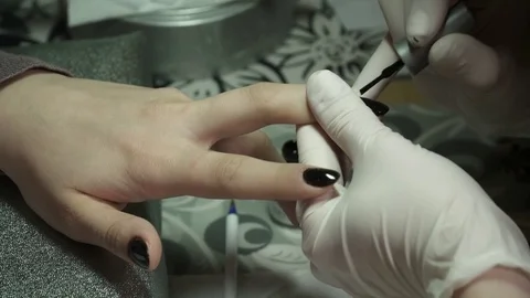 Customer is having the manicure with the gel pilish done Stock Footage