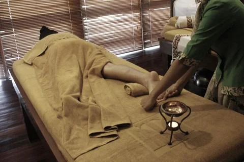 A customer is having a massage at the spa. Stock Photos