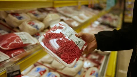 Customer Holding a Ground Beef Meat Package at the Grocery Store Stock Footage