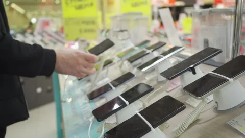 Customer interacting with smartphone displays Stock Footage 297225895