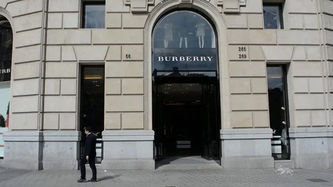 Customer leaves Burberry store Stock Footage 102335514
