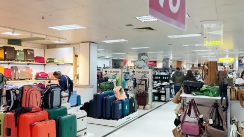 A customer is looking for a bag in Kaufring, Weil am Rhein, Germany Stock Footage 332117453