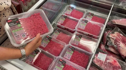 Customer looking for delicious minced beef at meat zone in a local supermarket. Stock Footage 203932131