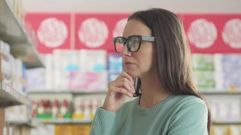 Customer looking for products on the store shelf Stock Footage 297850661