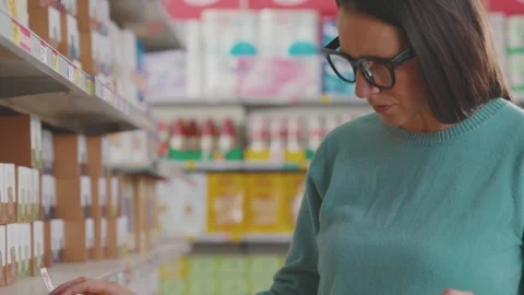 Customer looking for products on the store shelf Stock Footage 297850665