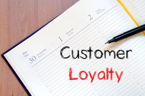 Customer loyalty write on notebook Stock Photos