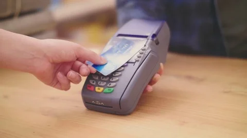 Customer making contactless payment through credit card Stock Footage 79659652