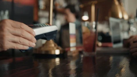 Customer making wireless or contactless payment using credit card. Smiling Stock Footage 89971962