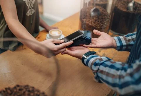 Customer making wireless or contactless payment using credit card using NFC  Stock Photos