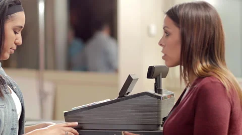 Customer at a marijuana shop paying for a product with cash Stock Footage 59171838