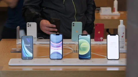 Customer new iPhone 12 and iPhone 12 Pro on display during launch day in Apple Stock Footage 141772226