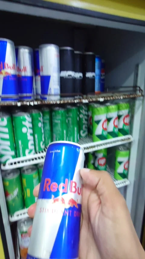 Customer Opening Beverage Cooler &amp; Taking RedBull Can: Sibi, Pakistan 4 Aug 2026 Stock Footage 341468461