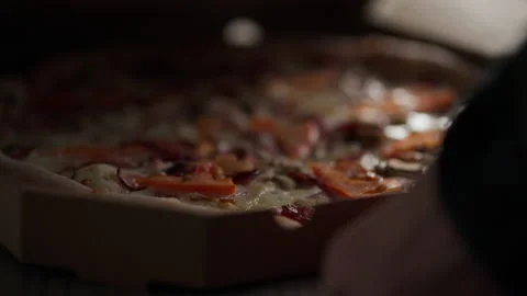 The customer opens a cardboard box with fresh pizza, Freshly baked pizza in Stock Footage 237194640