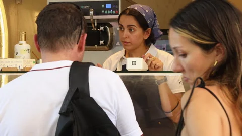 Customer Ordering at Counter in Valencia Shop with Staff Interaction Indoors Stock Footage 346002615