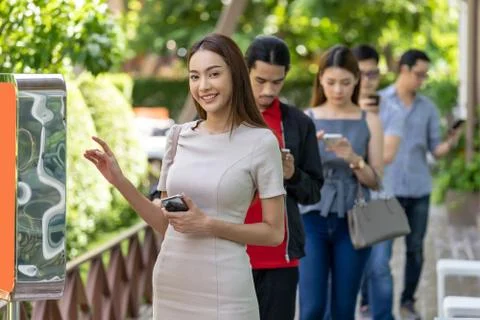 Customer ordering on touch screen kiosk in restaurant. Stock Photos