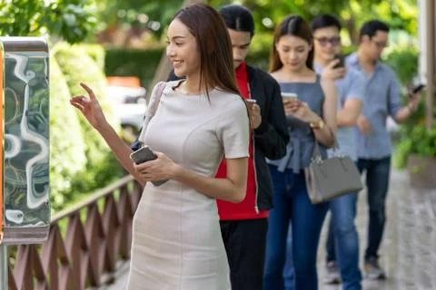 Customer ordering on touch screen kiosk in restaurant. Stock Photos
