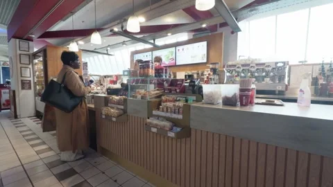 Customer Orders drink and snacks at Coffee Counter Inside Café Scene Stock Footage 340118335